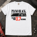 White T-shirt showing fingerprints on a trim panel with 'Piano black. Clean for 0.7 seconds'.