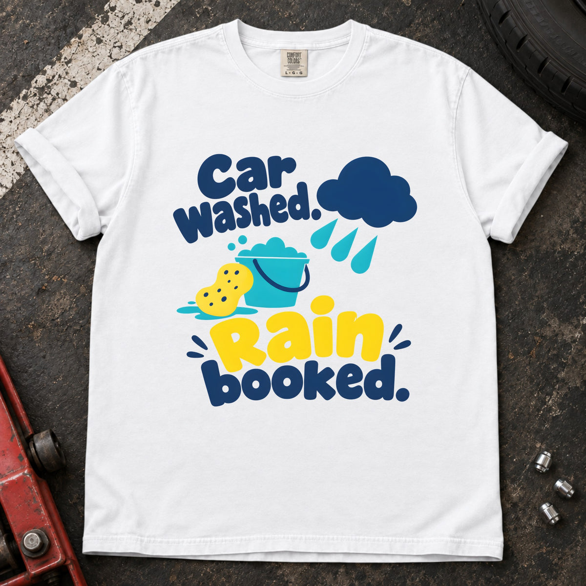 White T-shirt showing a rain cloud, droplets and cleaning sponge with 'Car washed. Rain booked'.