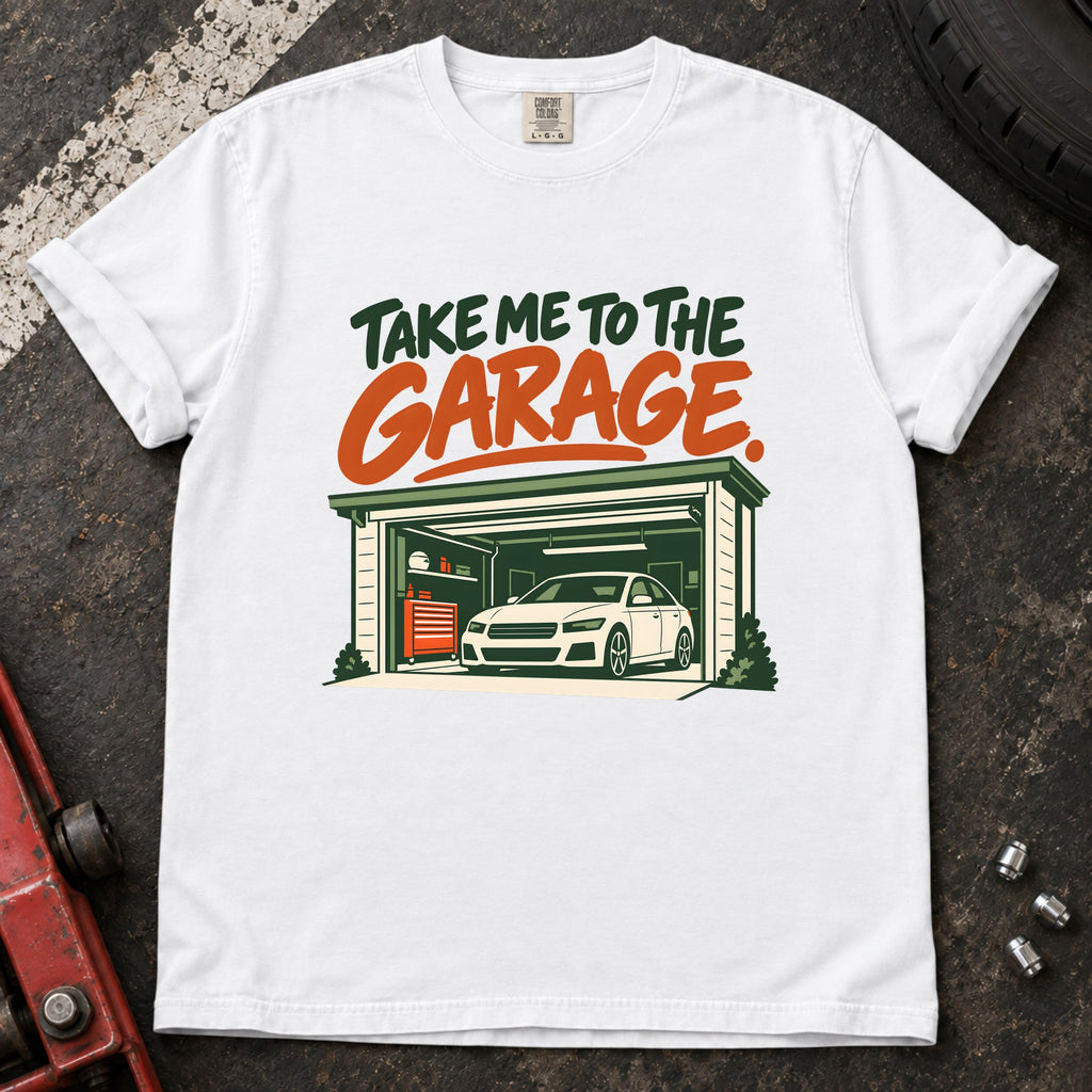 White T-shirt showing a car inside a garage beneath green and orange 'Take me to the garage' lettering.