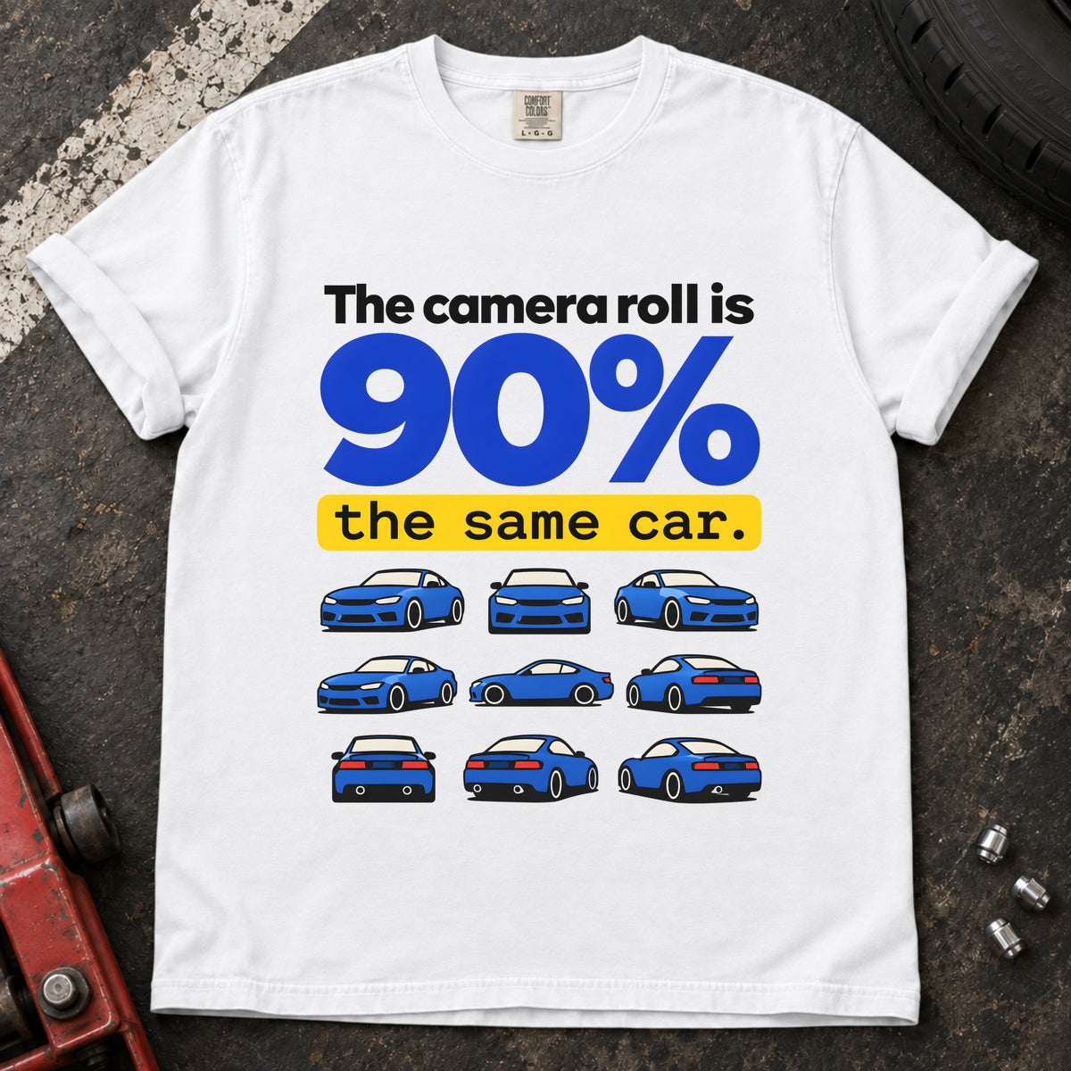 White T-shirt showing a grid of small blue cars with 'The camera roll is 90% the same car'.