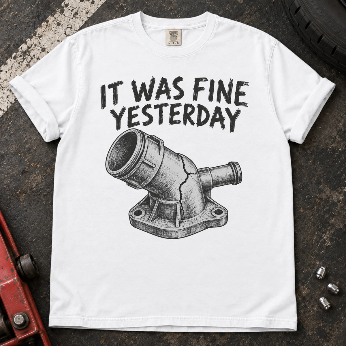 White car enthusiast T-shirt. A cracked coolant fitting proves it was fine yesterday.
